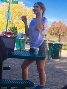 Awesome teen's legs photo at a street cafe