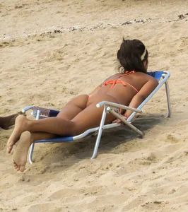 Orange thong bikini babe on the beach with a great ass