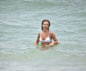Two sexy ass girls on the beach in bikinis