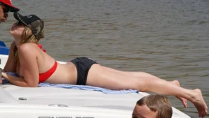 Big boobed blonde in red top bikini with nice cleavage