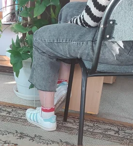 Teen Girl’s Legs in Jeans And Sneakers Ankles Closeup Creepshot