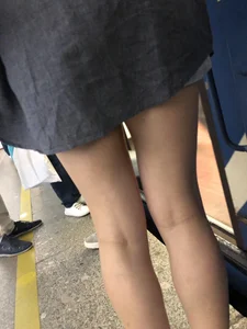 Very hot candid girl sitting in a subway train, closeups of her legs