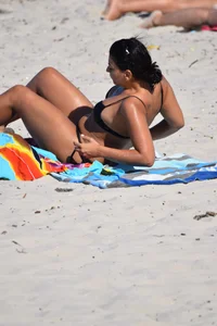 Thick mature brunette bikini lady on the beach with a nice body