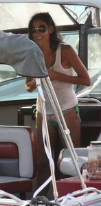 Bikini babe on a boat with a wet see through white shirt showing her tits