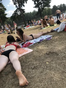 Pale Girl in Swimsuit Lying on a Lake Beach With Her Friends Creepshots Gallery