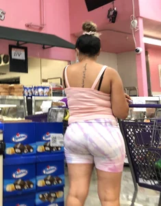 Thick Latina babe with a nice ass in tight patterned shorts