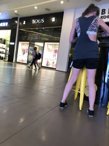 Tattoed Girl in Shorts and a Top Mall Candid Photo