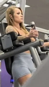 Petite blonde with bubble butt in blue spandex shorts