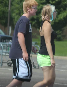 Blonde girl in glasses with a thick booty in green shorts