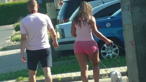 Thick booty babe walking her dogs in pink shorts