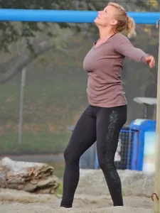 Beach volleyball blonde lady in tight leggings