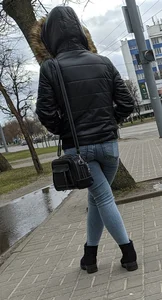 Girl in Tight Jeans Standing with Crossed Legs on the Street Winter Candid