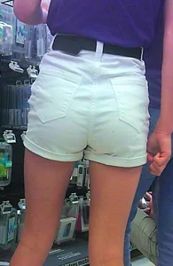 Cute skinny girl shopping in white denim shorts