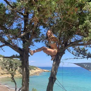 Hot Girl in a Swimsuit Sitting on the Tree
