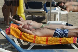 Girls on a nude beach in Sitges, Spain