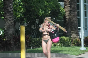 Sexy alt bikini babe with a nice body and tattoos
