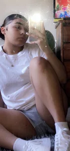 Girl in mini shorts mirror selfie