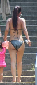 Sexy brunette milf in a bikini with a great body, nice ass and some camel toe