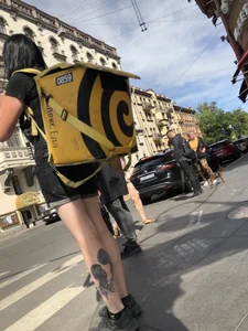 Amazing cute candid food delivery girl with lots of tattoos crossing the street