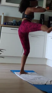 Sexy girlfriend doing yoga at home in leggings