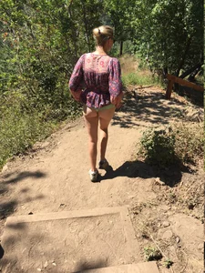 Girl Pulling Up Her Dress And Flashing Her Booty During a Walk in the Forest