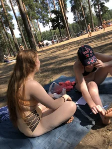 Girl in Swimsuit Sitting With Crossed Legs