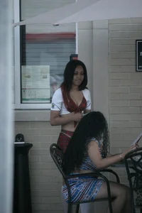 Two sexy Tilted Kilt employees showing cleavage and cheeks