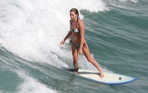Candid surfer babes on the beach and in bikinis