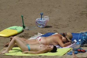 Girls on a nude beach in Sitges, Spain