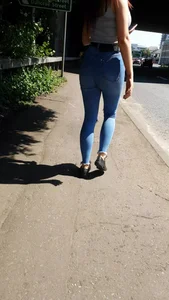 Redhead with a nice ass in tight jeans walking