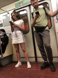 Candid Girl in a White Skirt and Sneakers With Hot Tanned Legs in Subway Train Creepshots