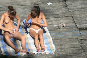Two teens stripping and going topless to tan
