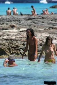 Nude beach ladies in the water showing their tits