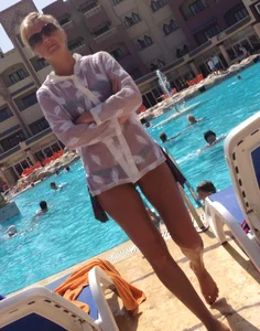 Sexy blonde babe in a bikini at the pool