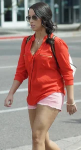Babe in pink shorts walking showing a bit of cleavage and almost a nip slip
