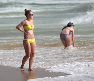 Big booty white girl in a yellow bikini at the beach