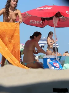 2 topless thonged sexy friends on the beach with great bodies