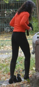 Sexy Girl in Tight Pants and Go-Go Boots Bend Over Street Creepshot