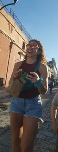 Laughing girl in shorts, legs and thick peach