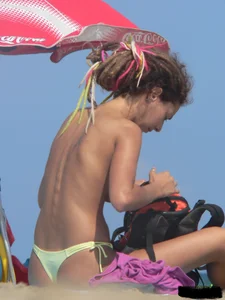 Sexy girls going topless at the beach showing off their sexy bodies