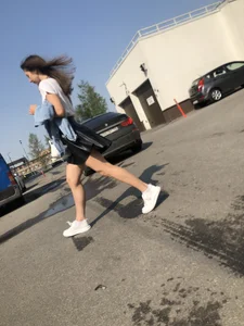 Awesome Candid Girl in a Leather Skirt And Sneakers Walking Down a Street, Then Flashing Her White Panties on the Stairs Creepshots Gallery