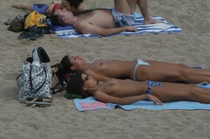 Topless girls on a beach in Barcelona