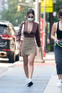 Emily Ratajkowski in mini skirt out for a walk with a friend in New York