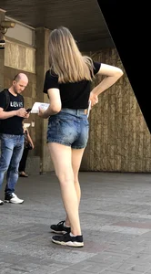 Cute Girl Distributing Leaflets in Shorts City Candid Gallery