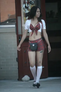 Two sexy Tilted Kilt employees showing cleavage and cheeks