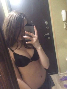 Cute Girl in a Bra with Flat Tummy Mirror Selfie