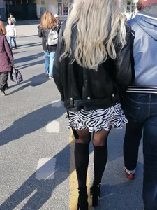 Awesome candid blonde wearing a zebra skirt and knee-high boots street creepshot, nice skinny legs closeups