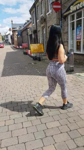 Big booty brunette girl out for a walk in leggings