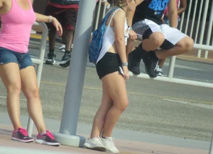 Couple of babes standing around in shorts