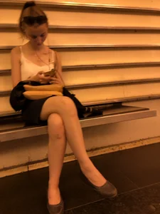 Hot girl sitting with crossed legs